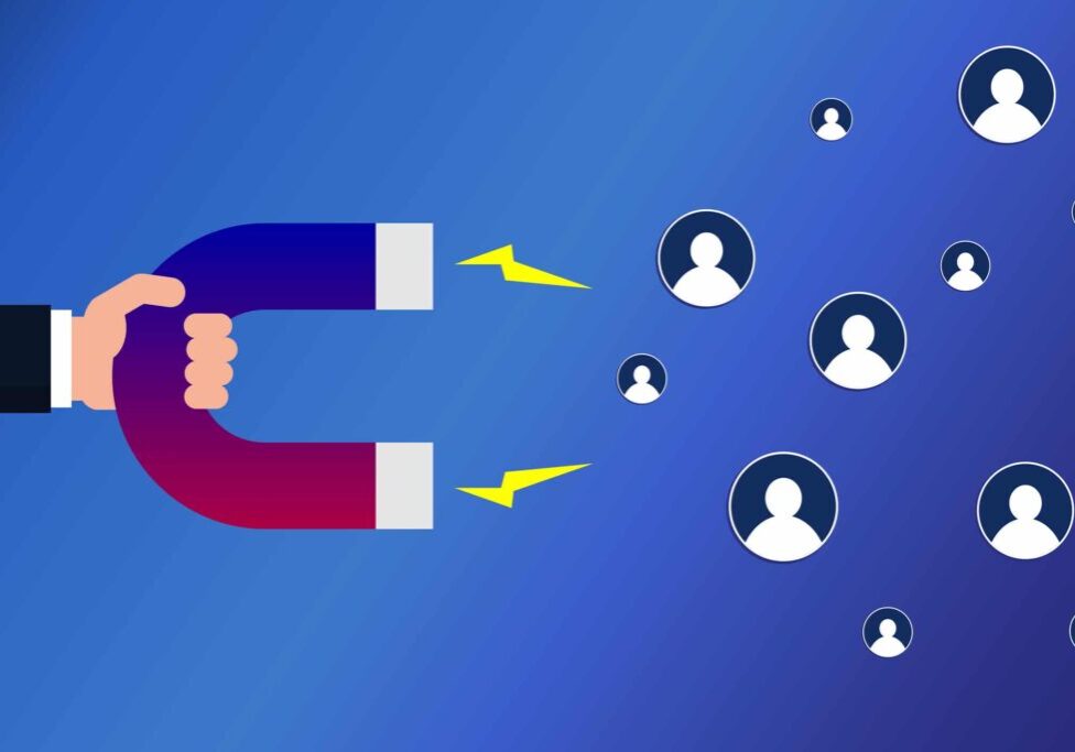 Hand with a magnet attracting followers. Social media marketing concept. Customer retention strategy. Influencer. Hand holding magnet dragging people icons. Vector illustration, flat style, clip art.