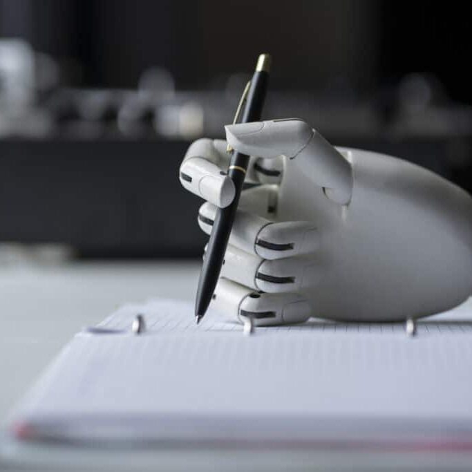 artificial robotic arm write down some notes with pen