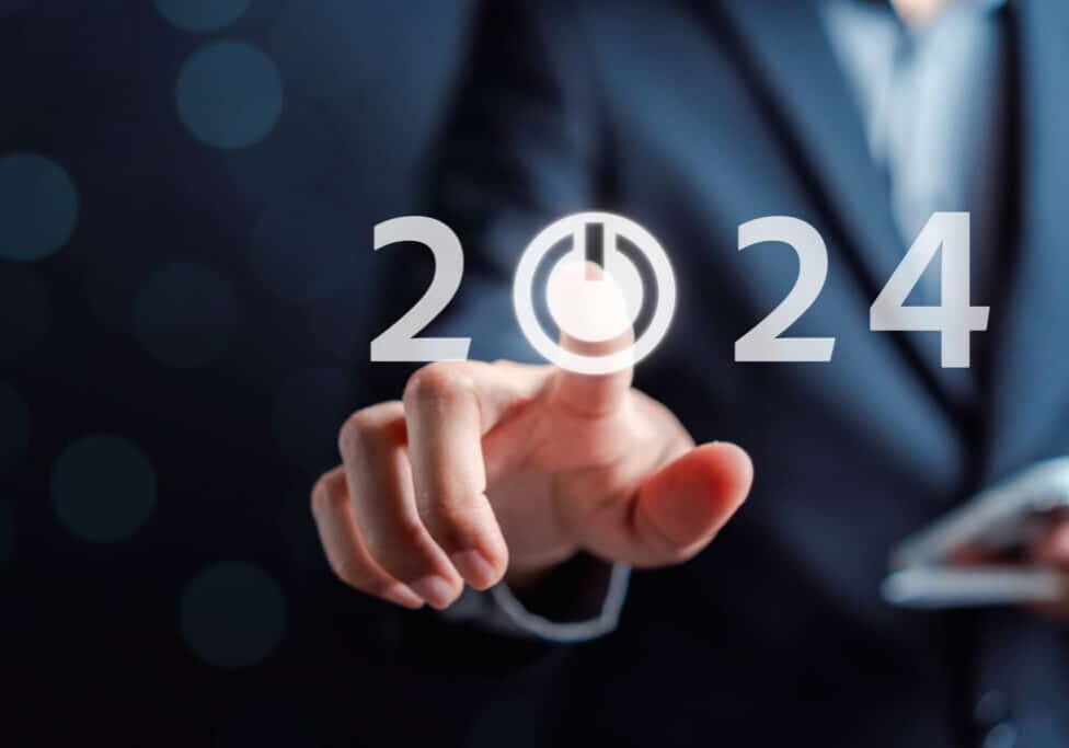 Happy new year Start 2024 from 2023 ,Finger hand of businessman start button 2024 planning business strategy, opportunity and change in future trends.