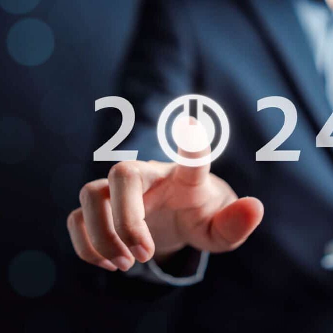 Happy new year Start 2024 from 2023 ,Finger hand of businessman start button 2024 planning business strategy, opportunity and change in future trends.
