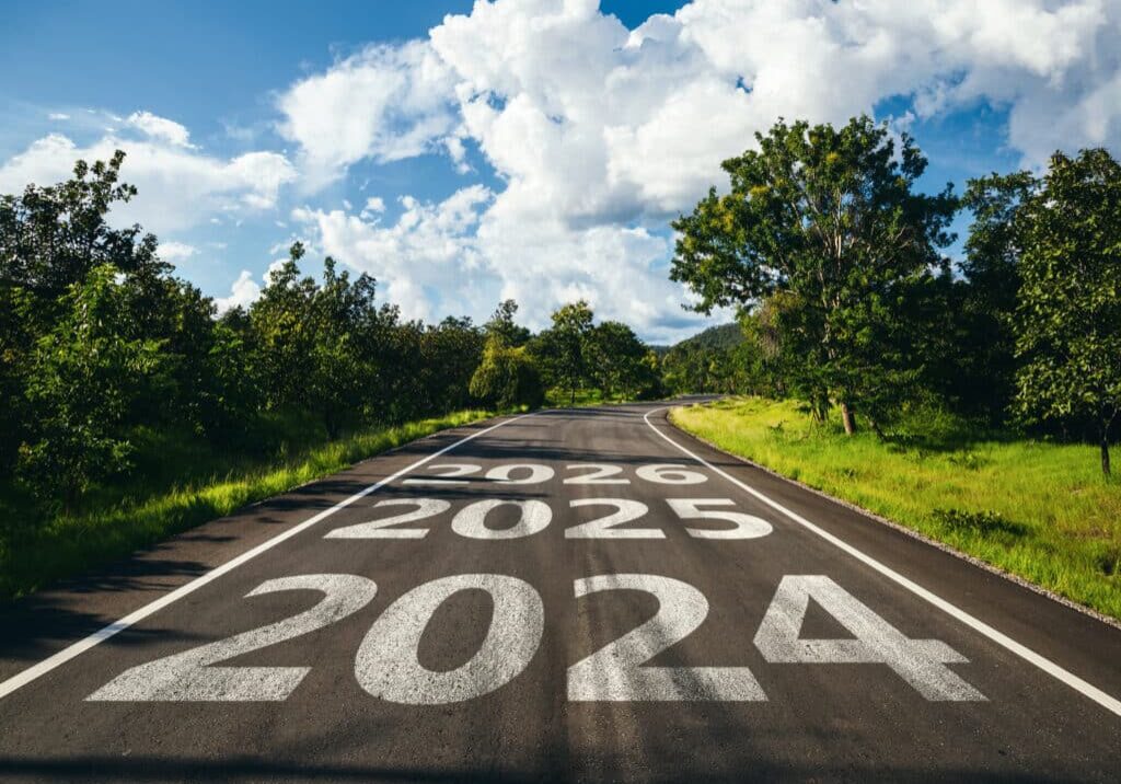 New year 2024 to 2026 written on the road in the middle of asphalt road. New year 2024 to 2026 written on the road in the middle of asphalt road, Planning of new year concept.