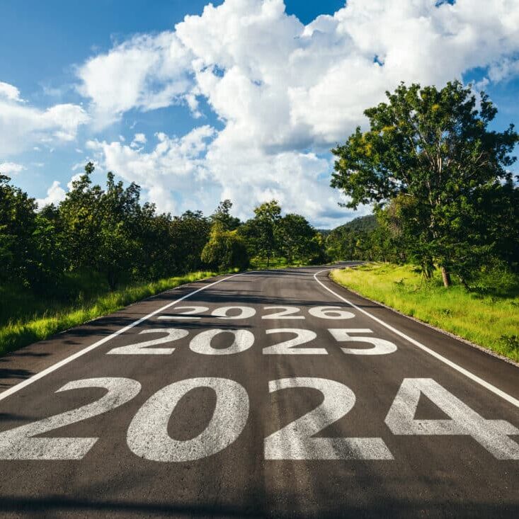 New year 2024 to 2026 written on the road in the middle of asphalt road. New year 2024 to 2026 written on the road in the middle of asphalt road, Planning of new year concept.